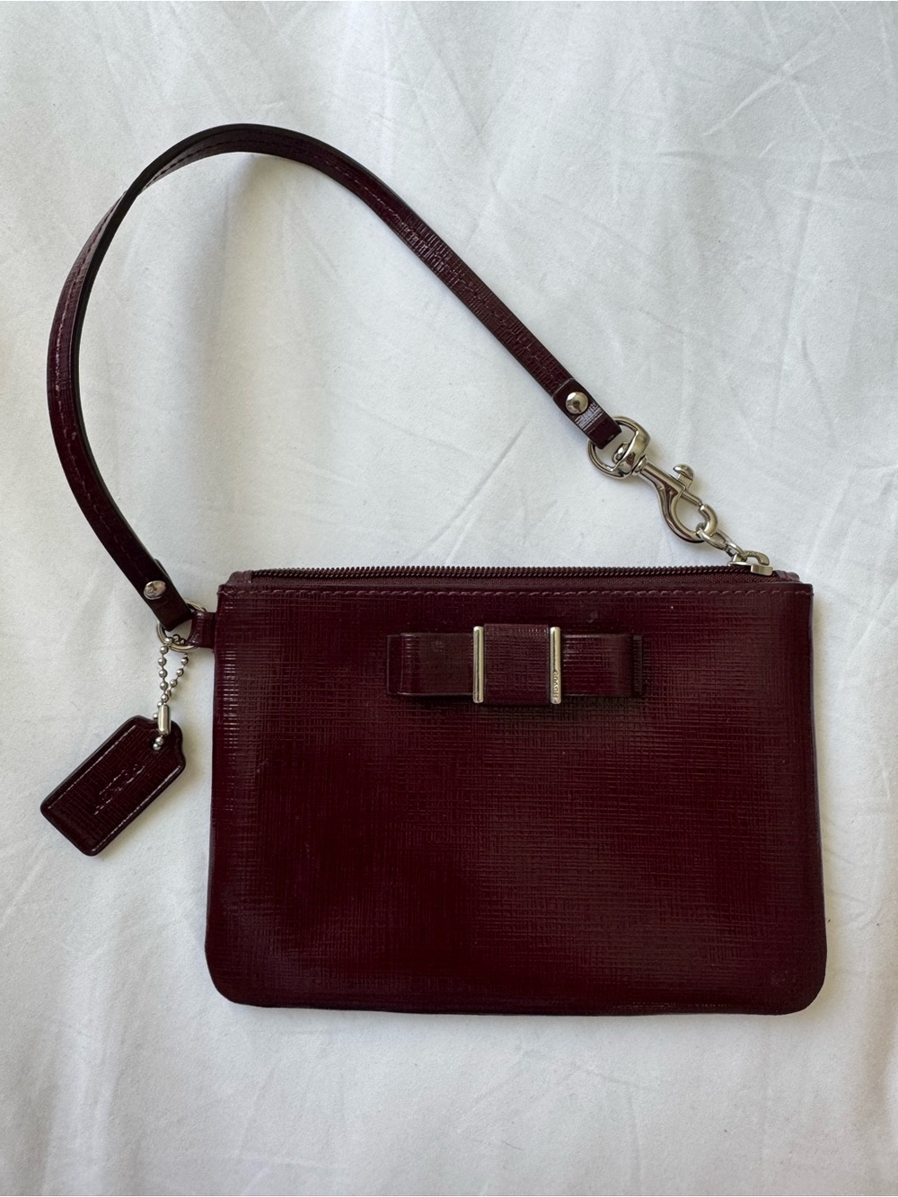 Coach Wine Red Leather Wristlet with Bow Accent